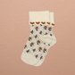 Kennedy children’s socks from Shop Little Millers, featuring a soft cream knit base with delicate floral detailing and subtle heart-inspired trim, designed for babies and kids with a snug yet stretchy fit for all-day comfort, everyday wear, and special outfits. Colors available are Mulberry, Spice or Dusty Pink.
